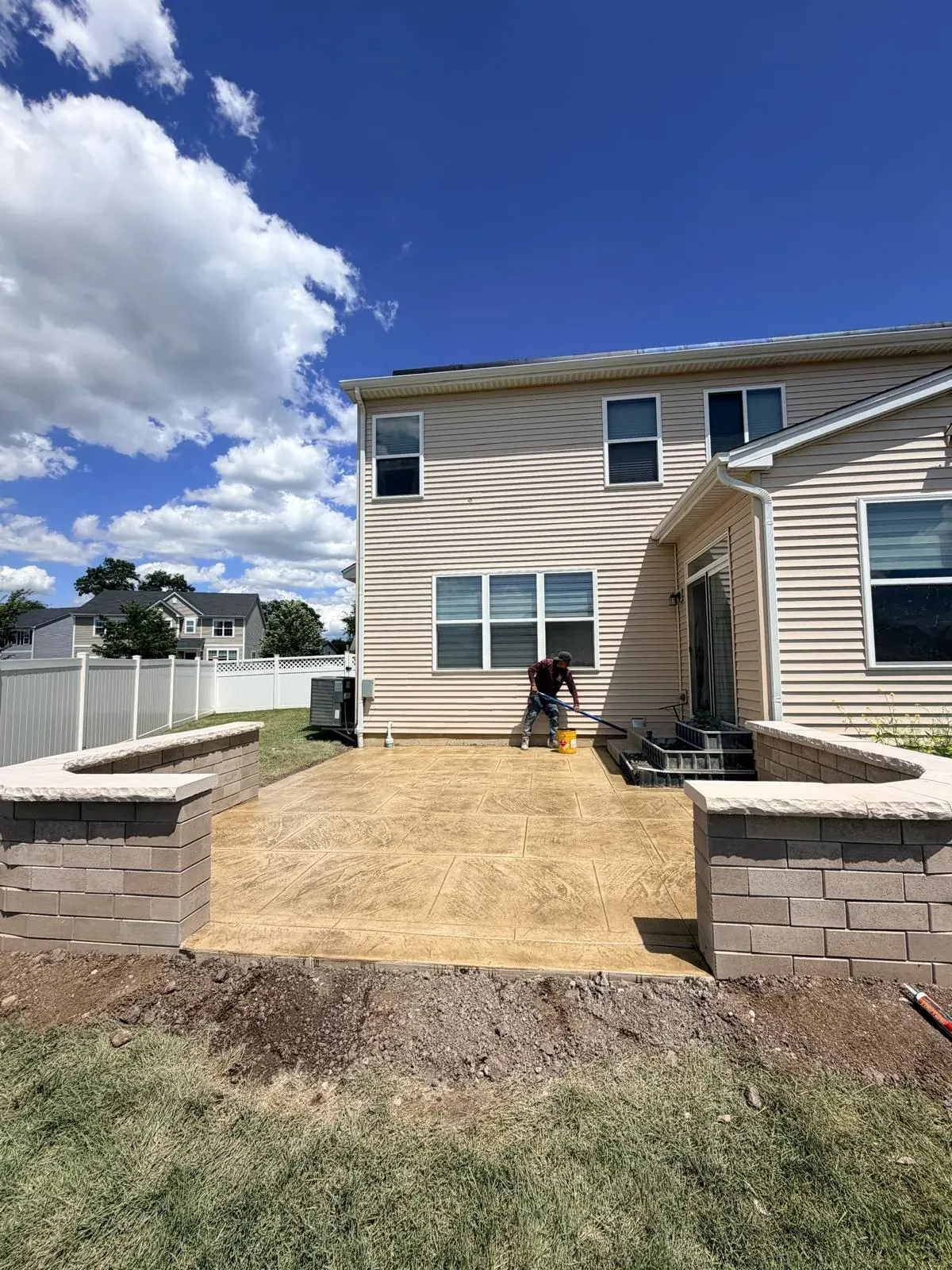 Stamped concrete patio with seat walls installed by Ortiz Concrete Services in Streamwood, IL